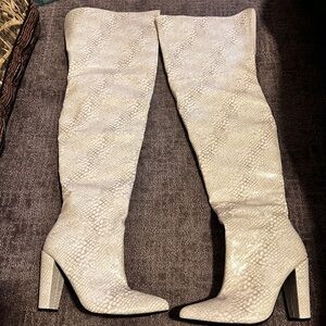 White snakeskin thigh high boots